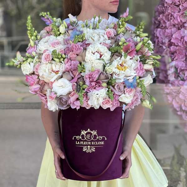 Large pastel bouquet in a burgundy hatbox
