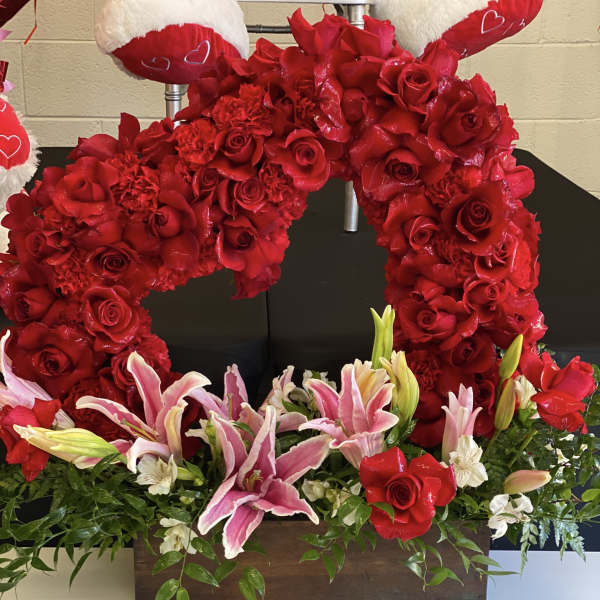 Heart-shaped red rose arrangement with pink lilies in a wooden box
