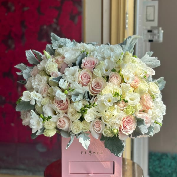 Pink and white rose bouquet in a pink box