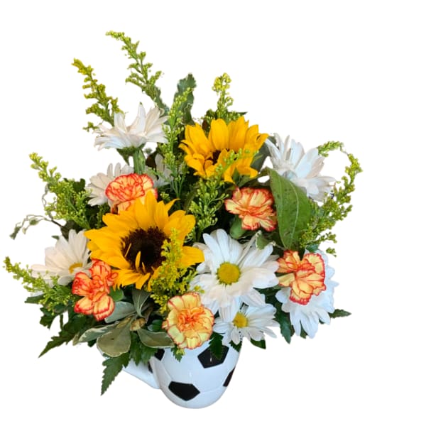 Bouquet of sunflowers, daisies, and carnations in a soccer ball vase
