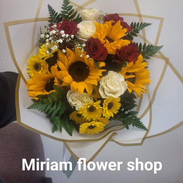 Bouquet of sunflowers, red and white roses, and baby's breath