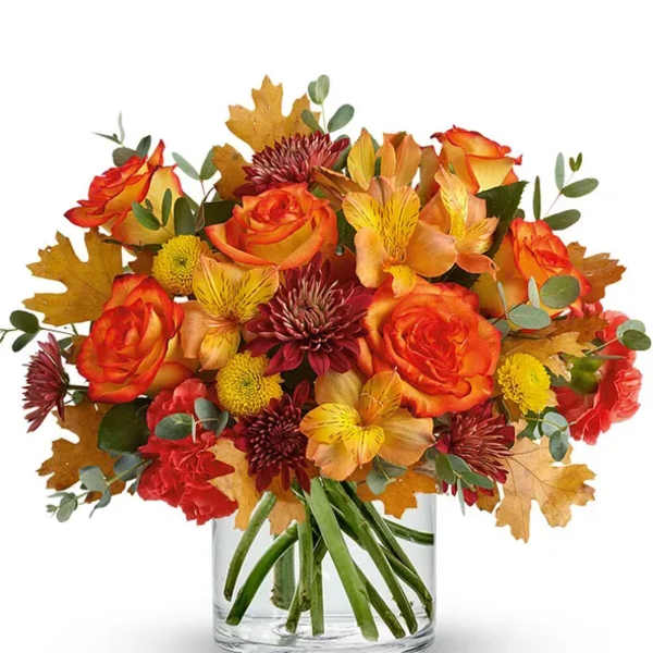 Orange and red bouquet in a clear glass vase