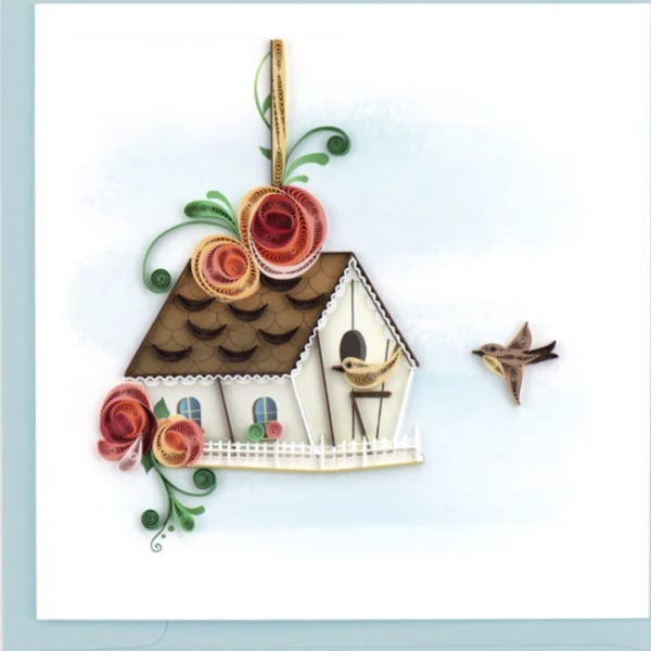 Greeting card with quilled paper birdhouse, two small birds, and decorative spiral flowers.