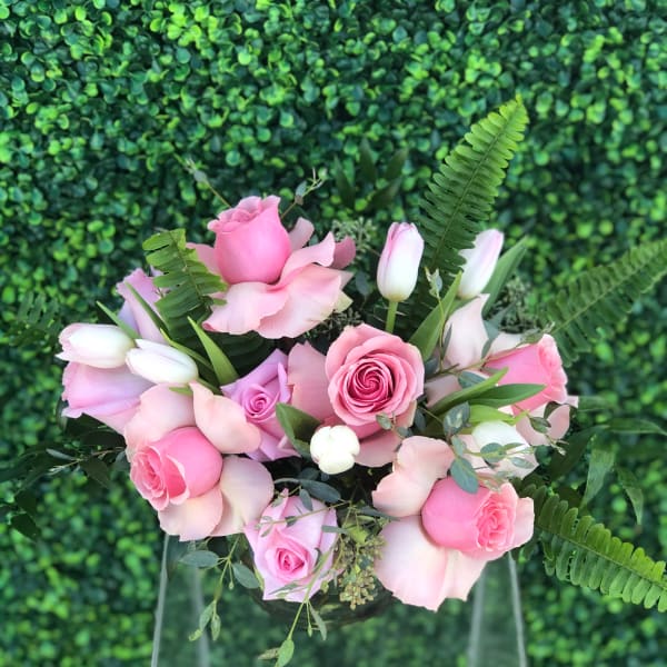 Pink rose bouquet with tulips and fern accents