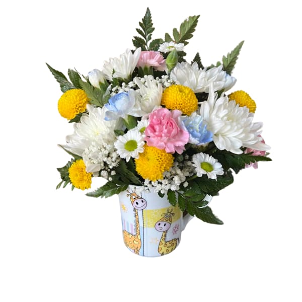 Bouquet of white, yellow, pink, and blue flowers in a giraffe-print mug