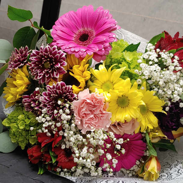 Colorful mixed bouquet with gerbera daisies, carnations, and baby's breath