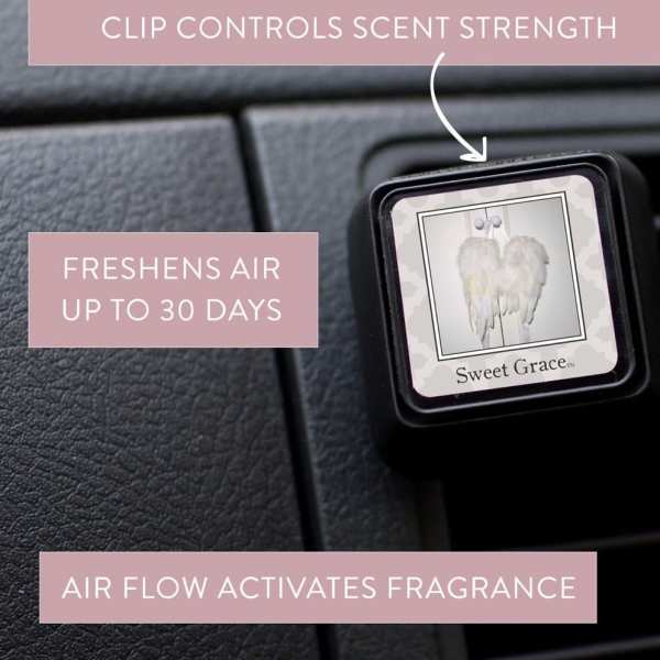 Car air freshener clip labeled Sweet Grace on a dashboard vent