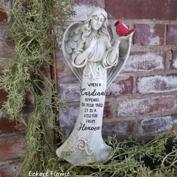 Angel figurine with a red cardinal and a memorial quote