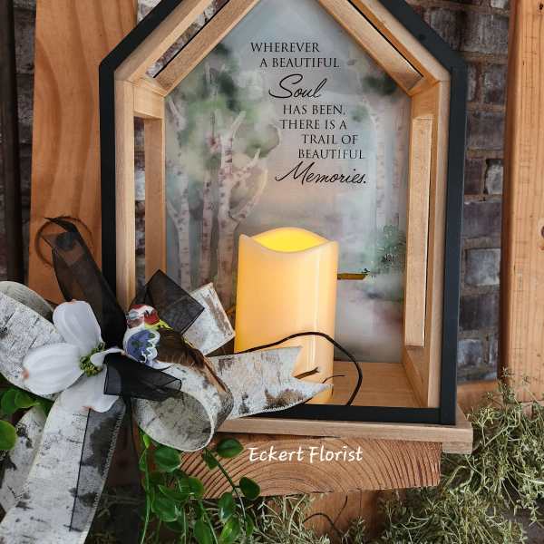 Wooden memorial lantern with a candle and floral bow