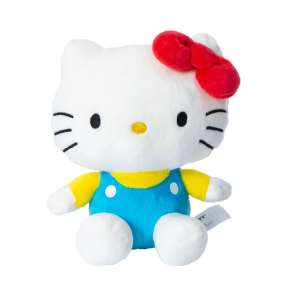 Hello Kitty plush toy in blue overalls with a red bow