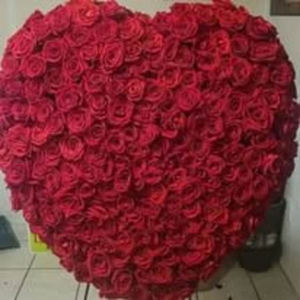 Large heart-shaped arrangement of red roses