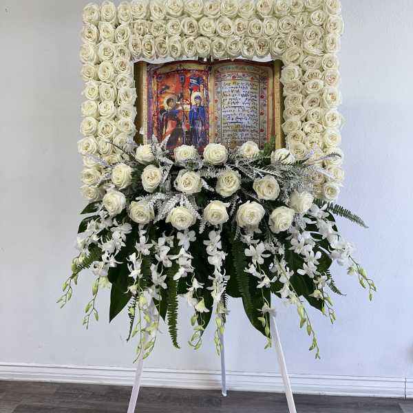White rose funeral easel with an icon in the center