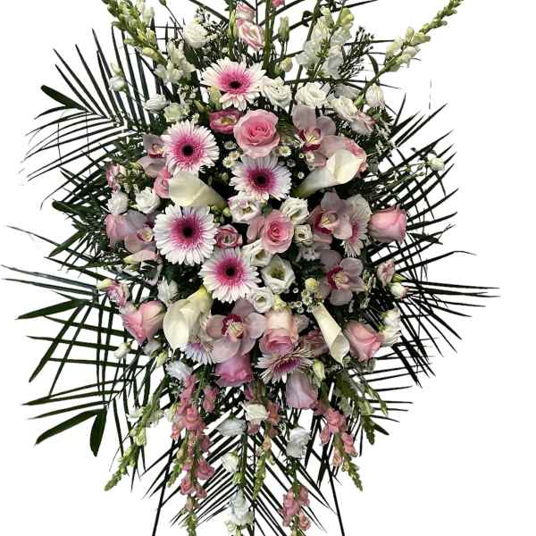 Pink and white floral standing spray with palm fronds