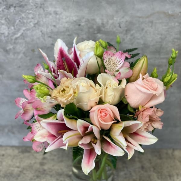 Bouquet of pink and white flowers in a glass vase