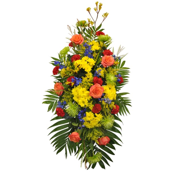 Tall standing floral spray with roses, chrysanthemums, and blue accents