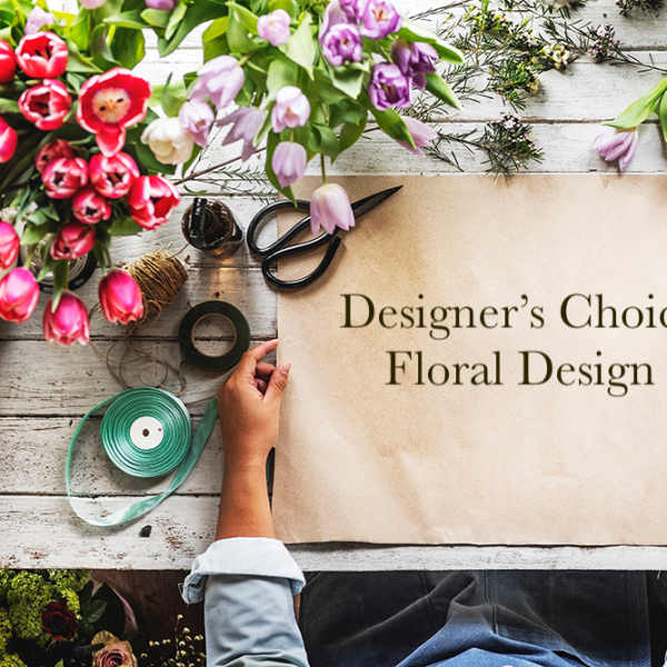 Designer’s Choice Floral Design sign surrounded by tulips and floral supplies