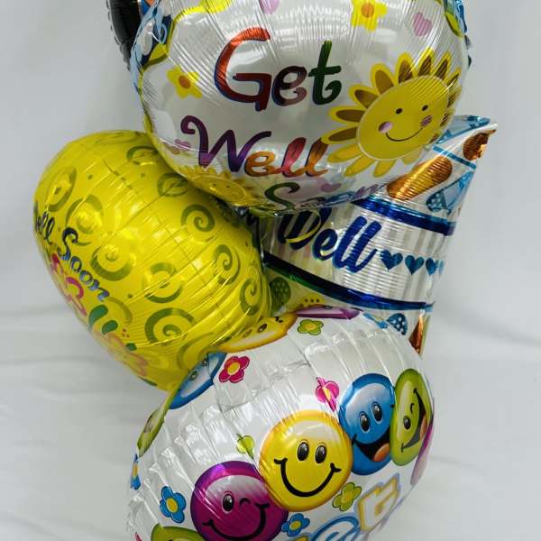 Stack of colorful get well balloons with smiley faces