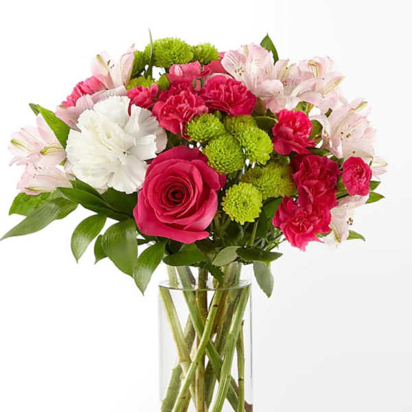 Bouquet of pink and white flowers in a clear glass vase