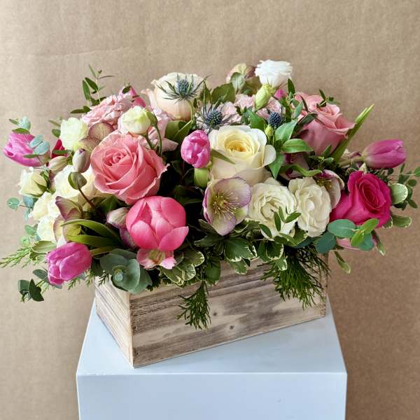 Pink and white mixed bouquet in a wooden box