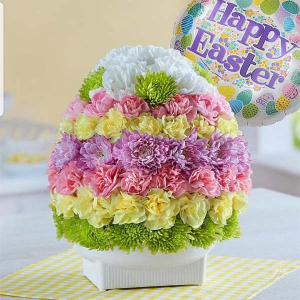 Round pastel flower arrangement with a Happy Easter balloon
