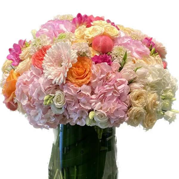 Mixed pastel bouquet in a glass vase