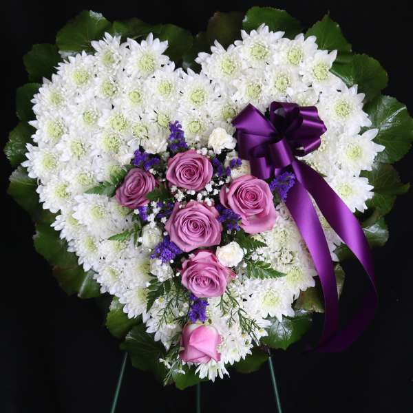 Heart-shaped floral spray with white chrysanthemums and pink roses