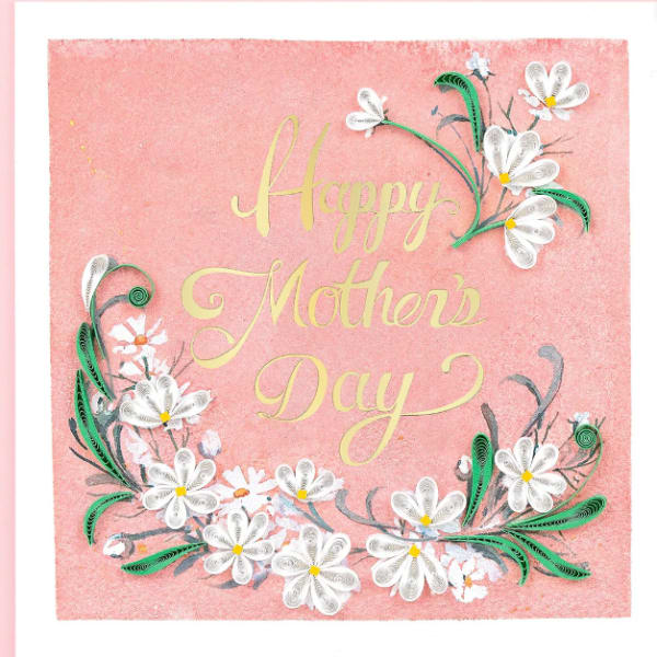 Pink Mother’s Day card with gold script and white daisy-like flowers along the edges