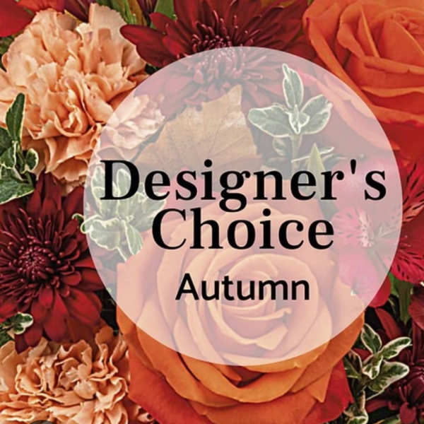 Autumn floral design with orange roses and burgundy blooms