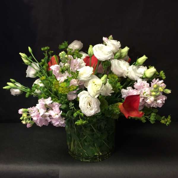 Bouquet of white and pink flowers in a glass vase