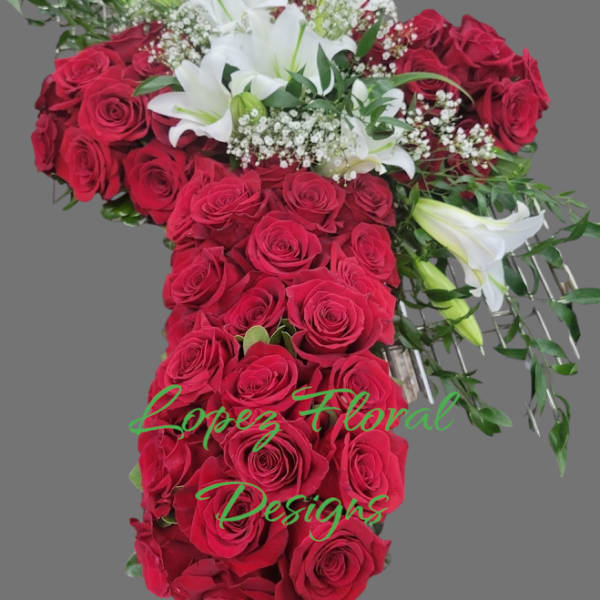Cross-shaped arrangement of red roses and white lilies