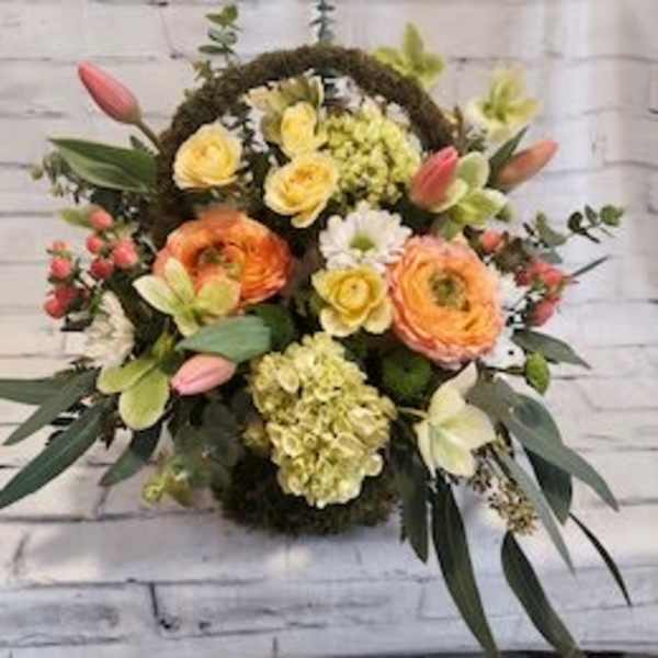 Mixed bouquet with orange and yellow blooms and pink tulips