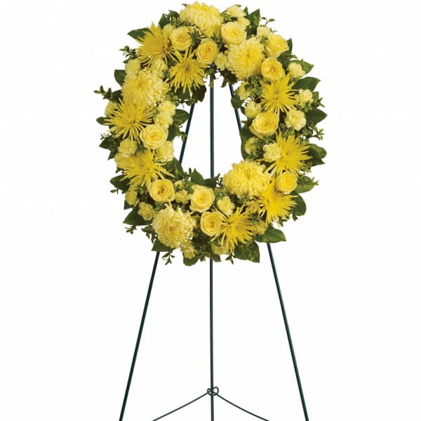 Yellow floral wreath on a standing easel