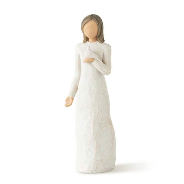 White figurine of a woman holding a bird
