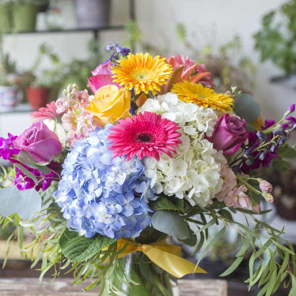 Colorful bouquet of mixed flowers in a glass vase