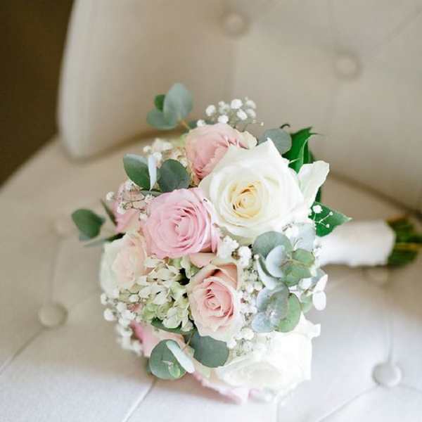 Small bouquet of pink and white roses with eucalyptus