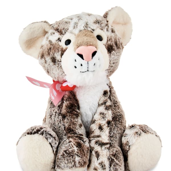Plush leopard teddy bear with a pink ribbon