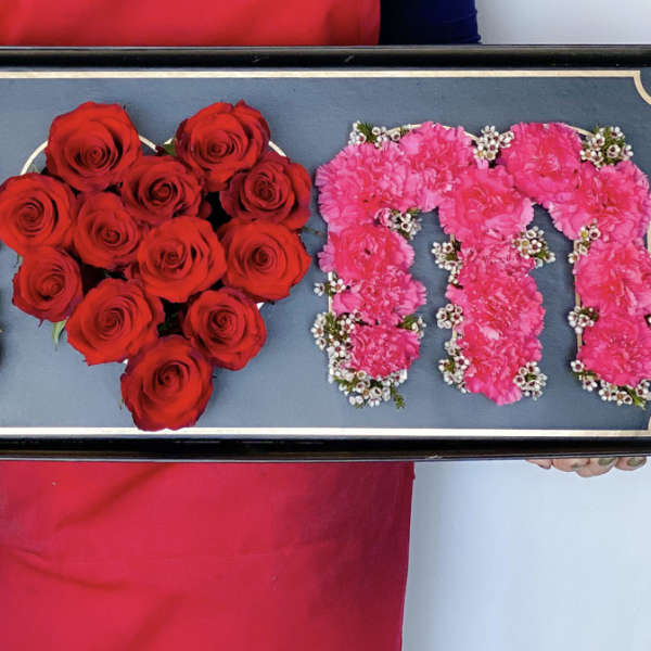 Tray with floral letters in white and pink and a red rose heart