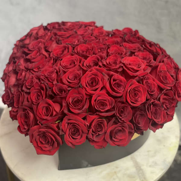 Large bouquet of red roses in a black box