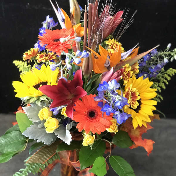 Colorful mixed bouquet with sunflowers, gerbera daisies, and lilies