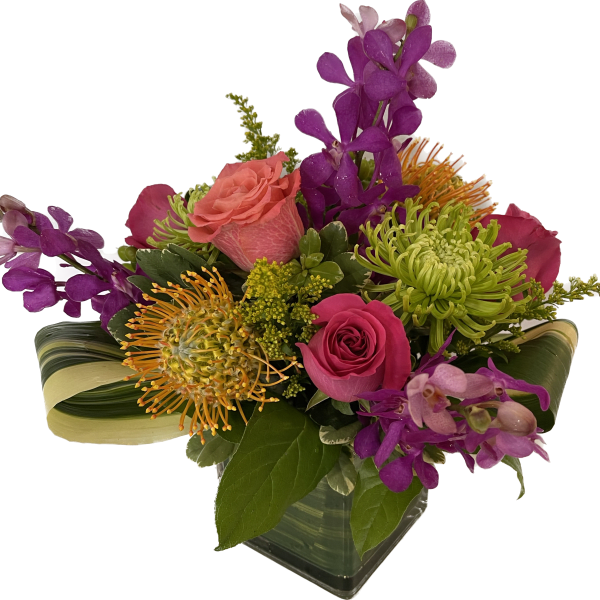 Mixed bouquet with pink roses, green spider mums, and purple orchids in a glass vase