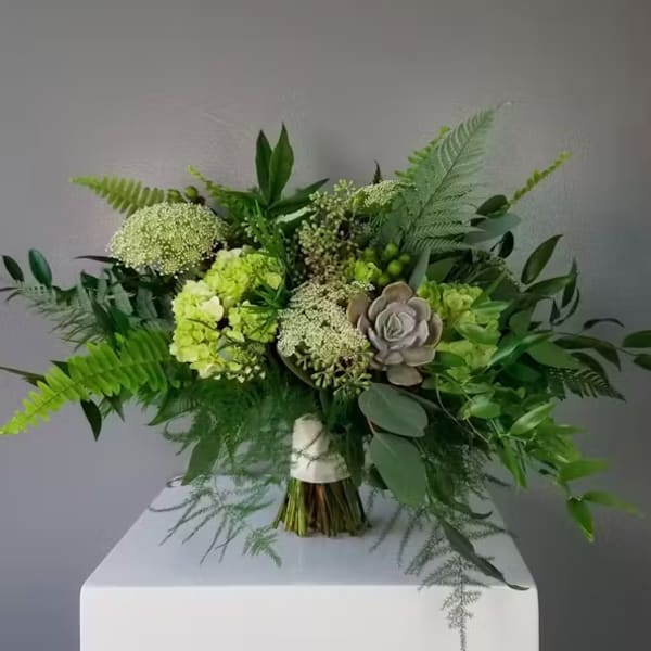 Green bouquet with hydrangeas and a succulent accent