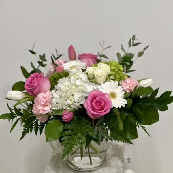 Pink and white mixed bouquet in a clear glass vase