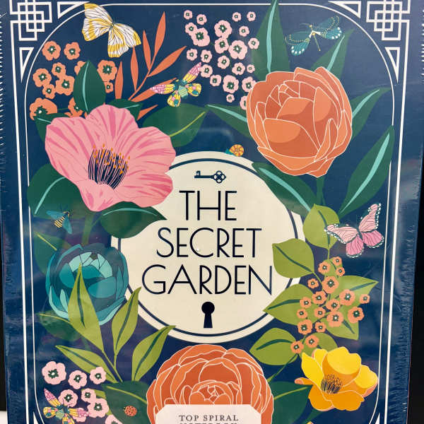 Floral-themed spiral notebook with colorful flowers and butterflies