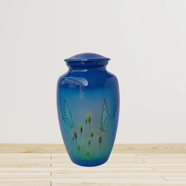 Blue glass urn with butterfly and flower designs