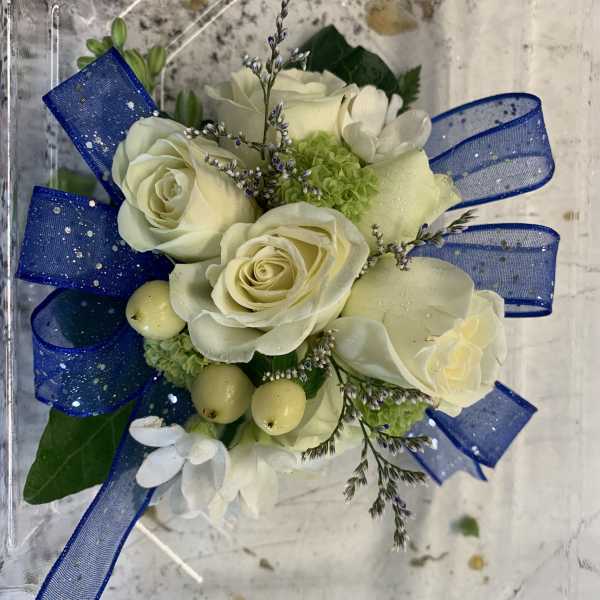 White rose bouquet with blue ribbon and small green accents