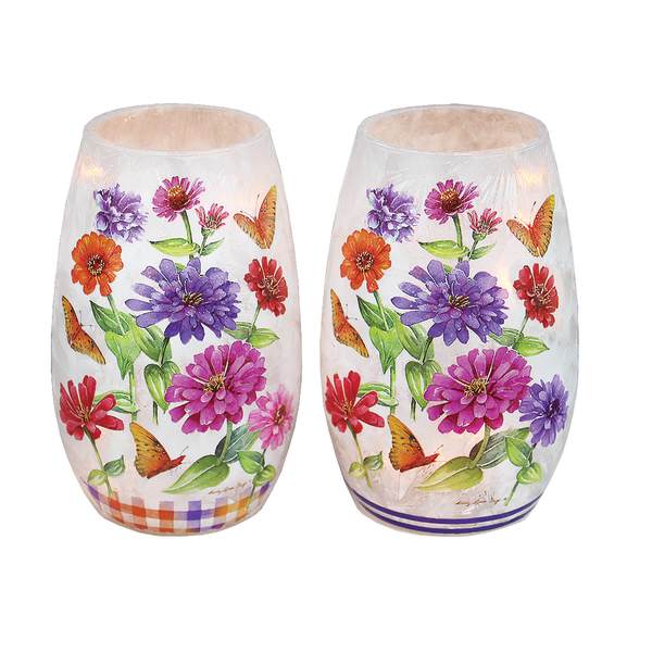 Pair of frosted glass candle holders with colorful flower and butterfly prints