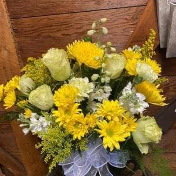 Yellow and white bouquet with a sheer ribbon bow