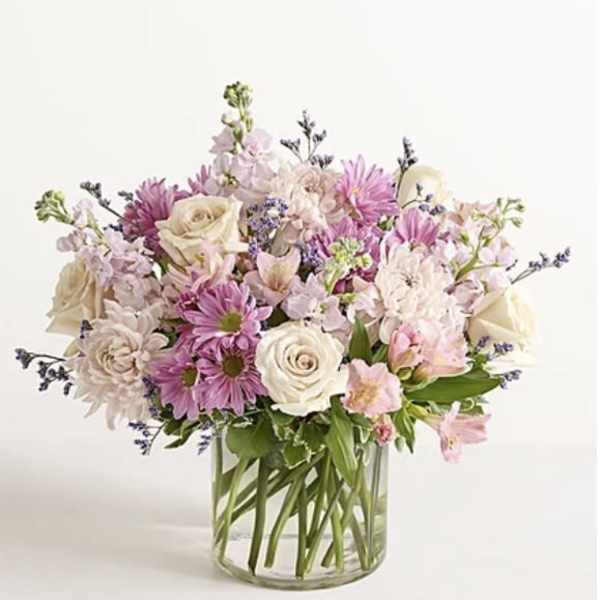 Bouquet of pink and white flowers in a clear glass vase