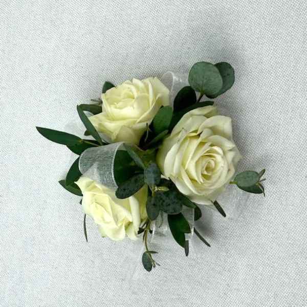 Small bouquet of cream roses with greenery and ribbon