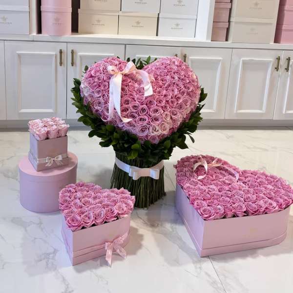 Pink rose heart arrangement with matching rose boxes and ribbon bows